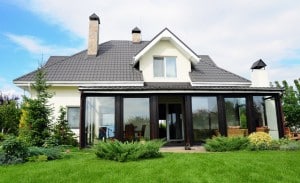 A new house with a garden in a rural area under beautiful sky