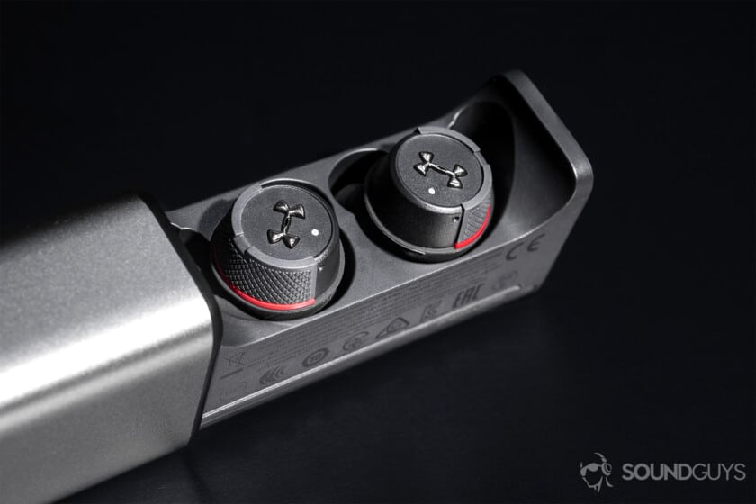 Under Armour True Wireless Flash JBL: Close up of the earbuds in the case with it sliding out.